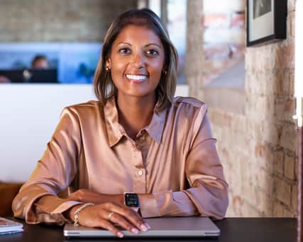 Two blurred people walking in a hallway.